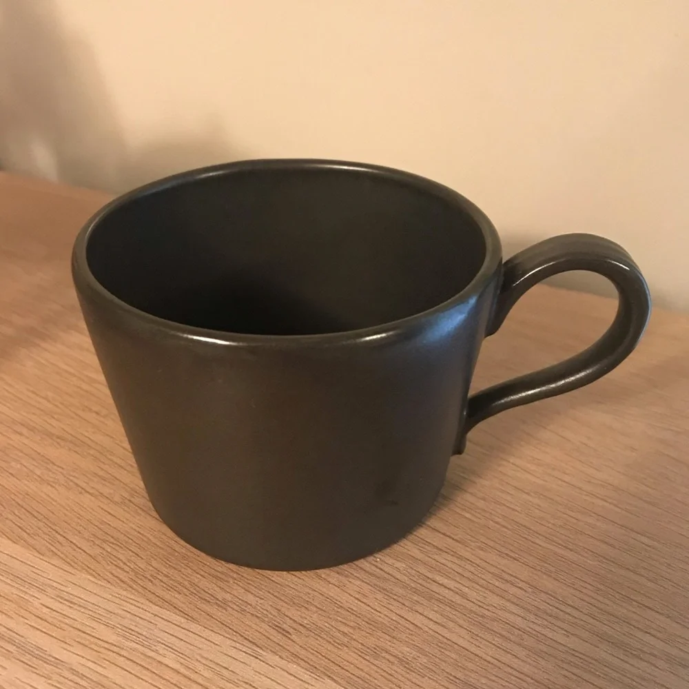 Black Anthropologie iridescent ceramic tea cup